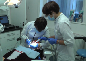 Dentists working on a patient at Blue Light Dental Clinic in North London