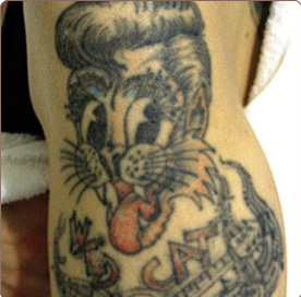 A cat tattoo before laser tattoo removal in north london