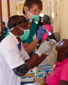 North London dentist Monika working with another dentist in Tanzania