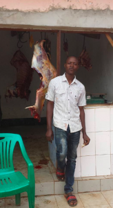 A man at a butchers in Tanzania where our team of expert london dentists volunteered
